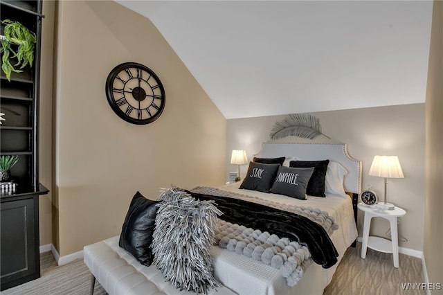 bedroom with vaulted ceiling