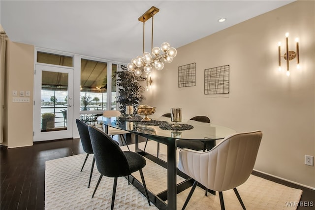 dining room featuring an inviting chandelier and hardwood / wood-style flooring