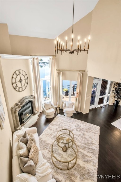 sitting room with dark hardwood / wood-style floors and a high ceiling