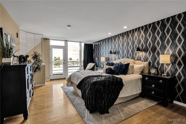 bedroom featuring access to outside and light wood-type flooring