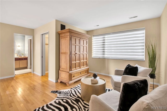 sitting room featuring light hardwood / wood-style floors