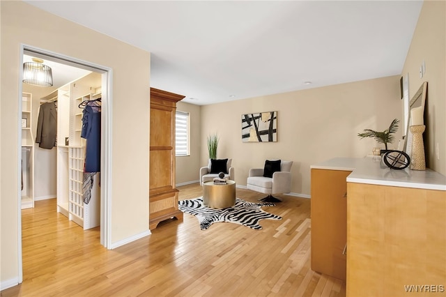 sitting room with light hardwood / wood-style flooring