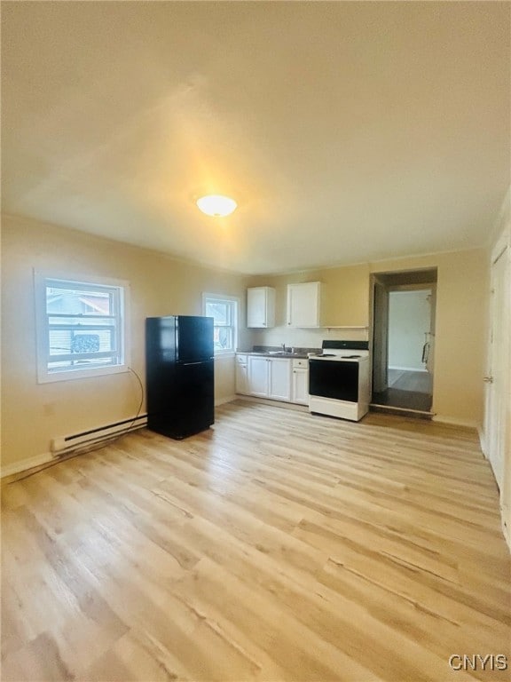 kitchen featuring electric range, baseboard heating, white cabinets, light hardwood / wood-style flooring, and black refrigerator