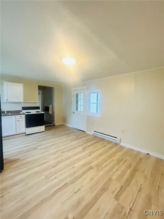 unfurnished living room with a baseboard radiator and light wood-type flooring