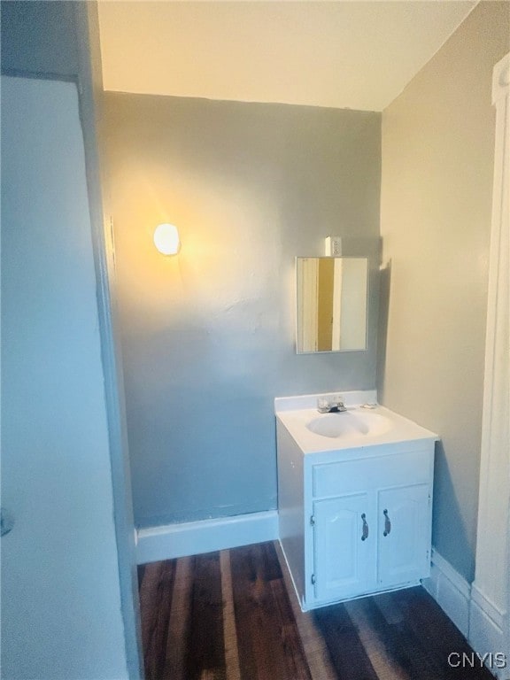 bathroom with vanity and hardwood / wood-style flooring