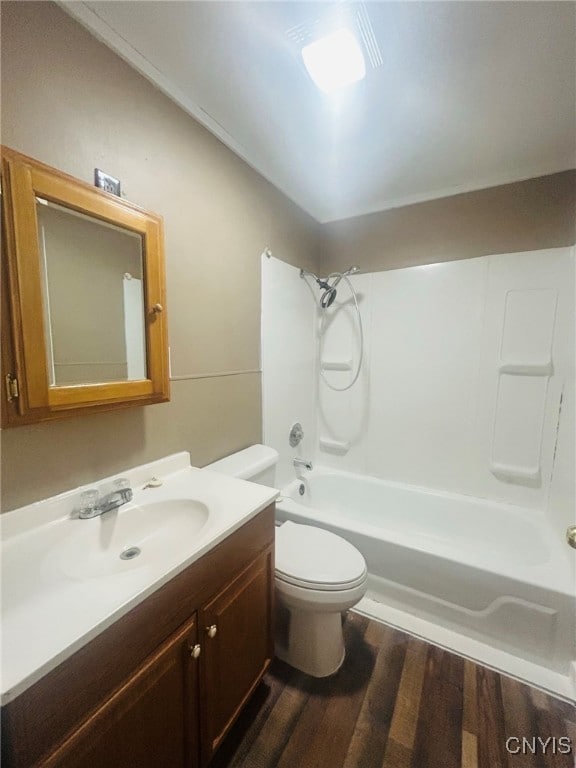 full bathroom featuring vanity, tub / shower combination, wood-type flooring, and toilet