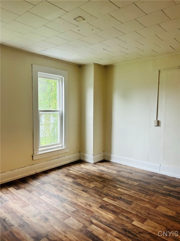 spare room featuring dark hardwood / wood-style floors