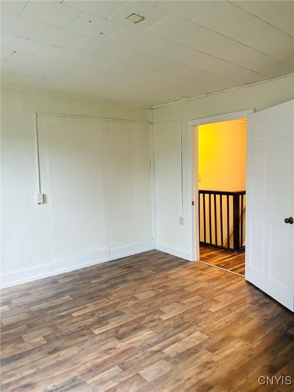 unfurnished room featuring hardwood / wood-style floors