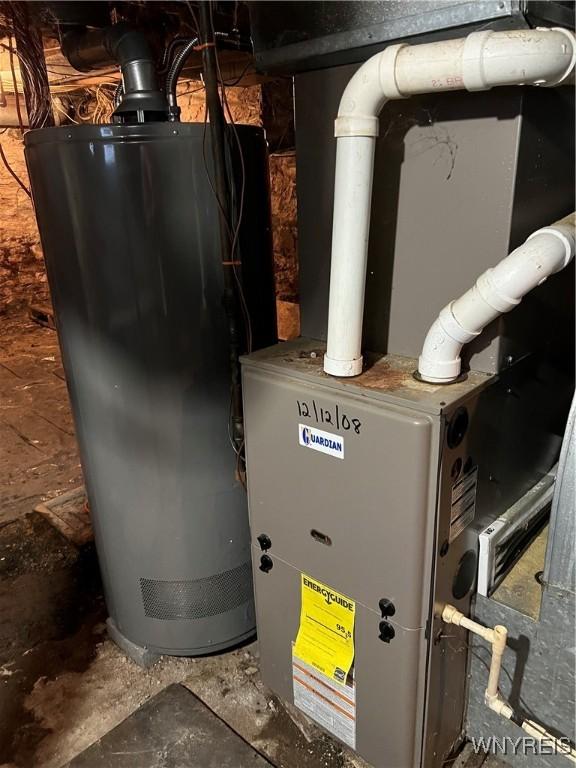 utility room with gas water heater and heating unit