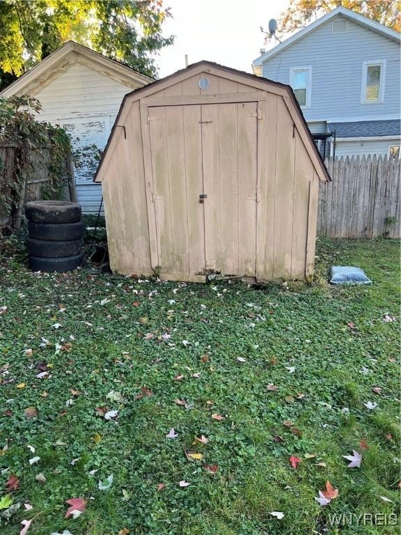 view of shed with fence