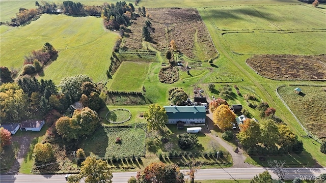 birds eye view of property featuring a rural view