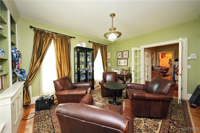 living room featuring french doors and wood-type flooring