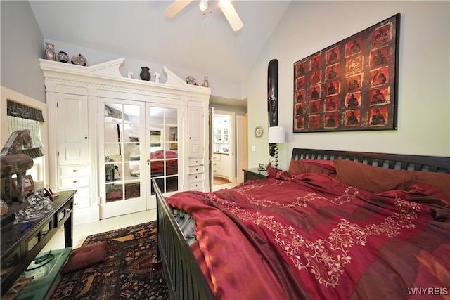 bedroom featuring ceiling fan, french doors, and vaulted ceiling