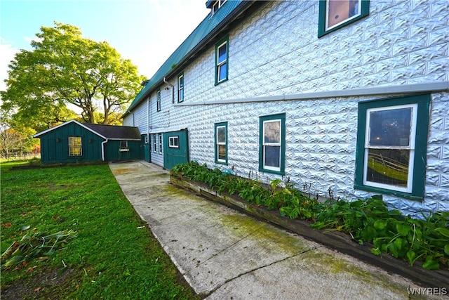 view of home's exterior with a yard