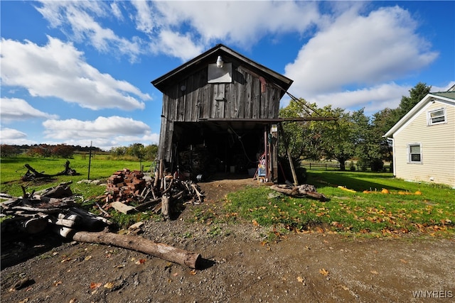 view of outbuilding featuring a rural view