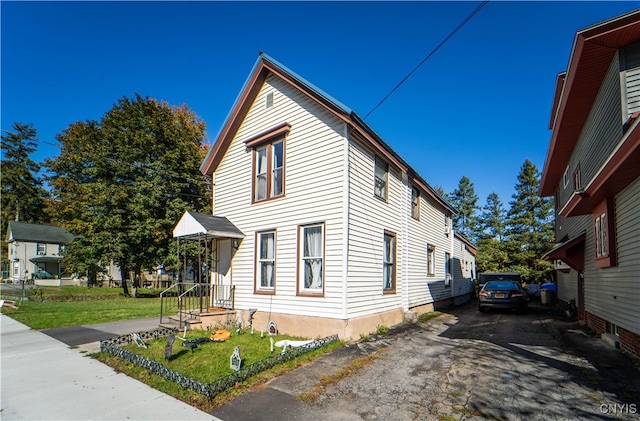 view of home's exterior with a yard