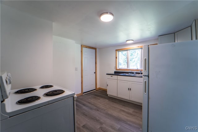 kitchen with sink, white cabinets, white appliances, and dark hardwood / wood-style flooring