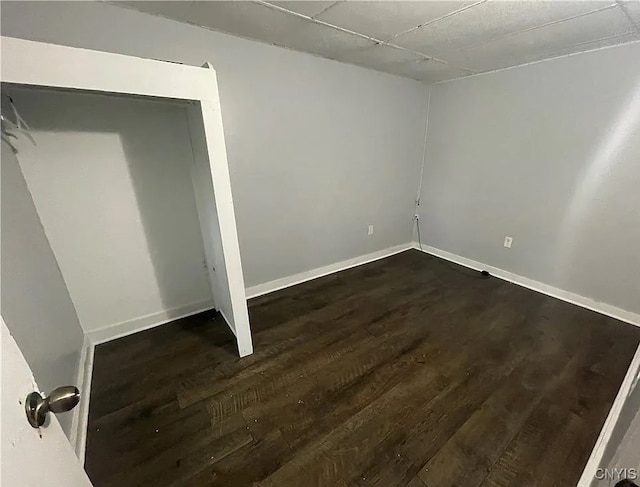 spare room featuring dark wood-type flooring