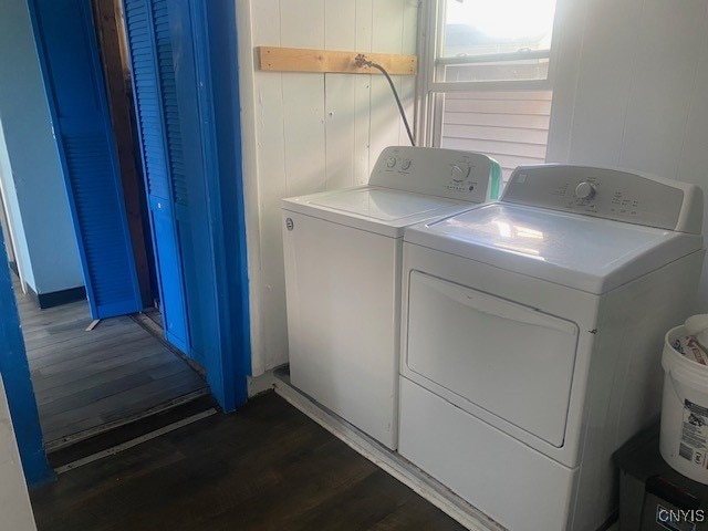 washroom featuring separate washer and dryer and dark hardwood / wood-style floors