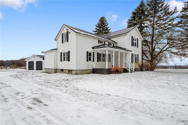 view of front of house with an outdoor structure and a garage