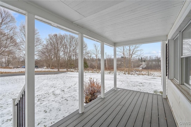 unfurnished sunroom featuring plenty of natural light