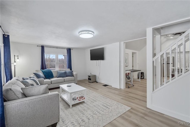 living room with light hardwood / wood-style flooring