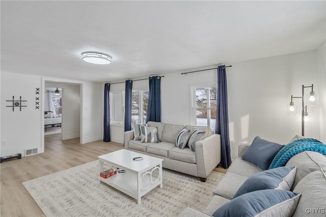 living room with light hardwood / wood-style floors