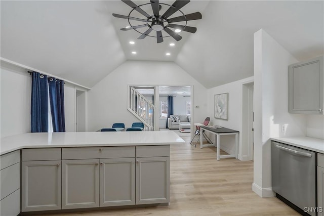 kitchen with gray cabinetry, dishwasher, vaulted ceiling, light hardwood / wood-style flooring, and ceiling fan