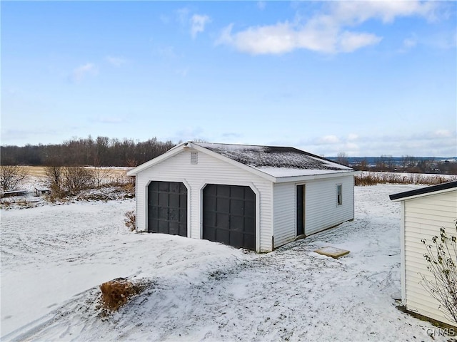 view of snow covered garage