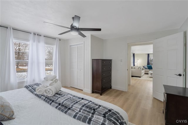 bedroom with ceiling fan and light wood-type flooring