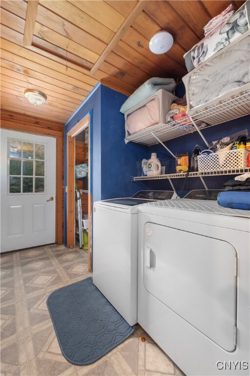 laundry room with washer and dryer and wooden ceiling