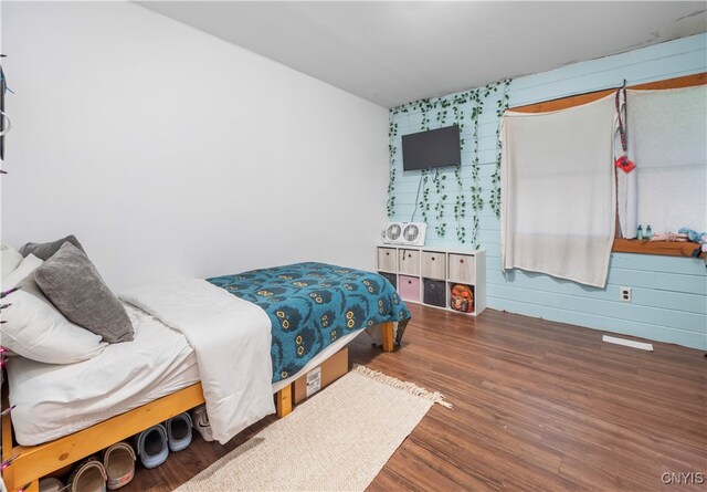 bedroom featuring dark hardwood / wood-style floors