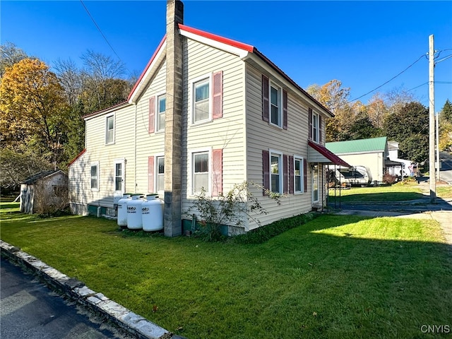 view of property exterior with a yard