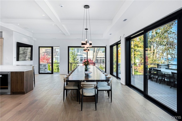 dining area with coffered ceiling, beamed ceiling, wine cooler, a chandelier, and light hardwood / wood-style floors