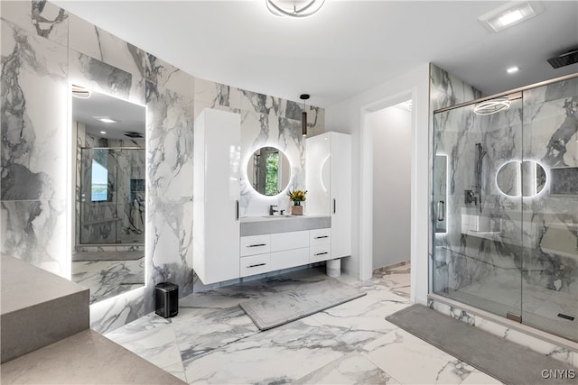 bathroom featuring tile walls, vanity, and walk in shower