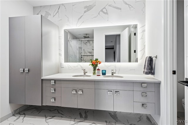 bathroom featuring vanity, an enclosed shower, and toilet