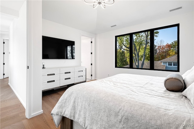 bedroom featuring wood-type flooring