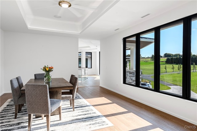 dining space with hardwood / wood-style floors