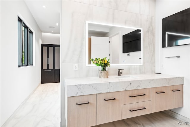 bathroom with vanity and hardwood / wood-style floors