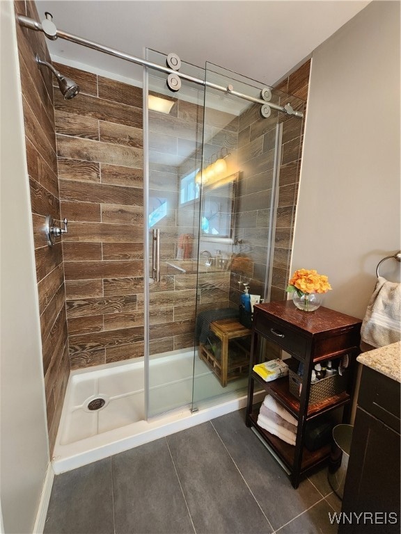 bathroom with vanity, tile patterned flooring, and walk in shower