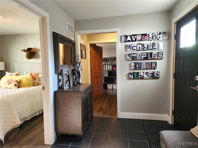 foyer with dark hardwood / wood-style floors