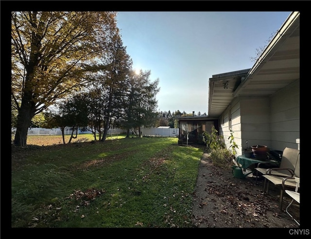 view of yard with a sunroom