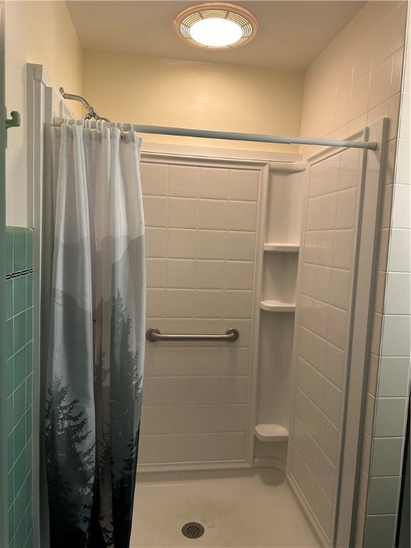 bathroom with a shower with shower curtain