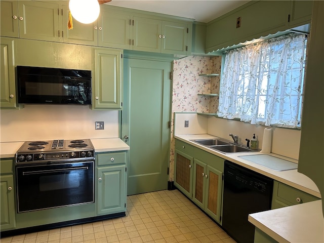 kitchen with black appliances, sink, and green cabinets