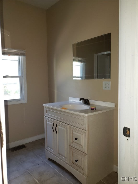 bathroom with vanity and tile patterned floors