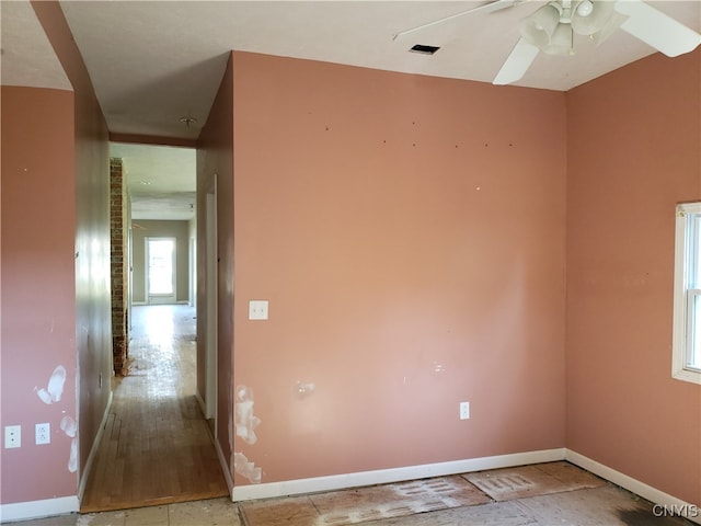 spare room with light hardwood / wood-style floors and ceiling fan