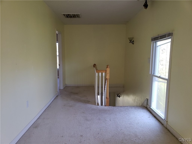 empty room featuring light carpet