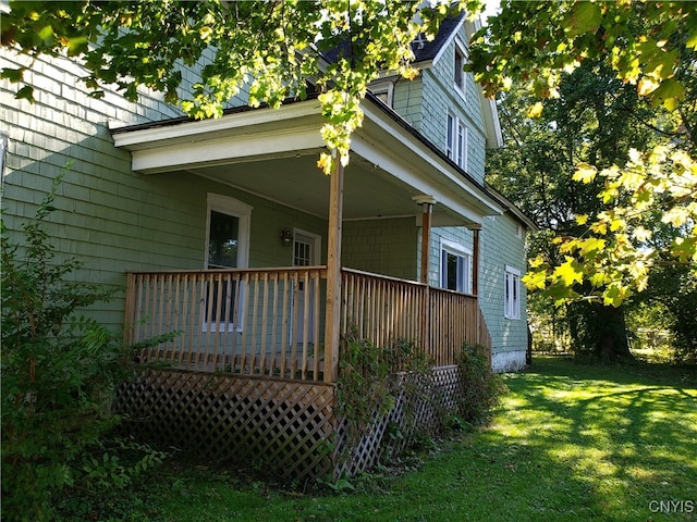 view of side of property with a lawn