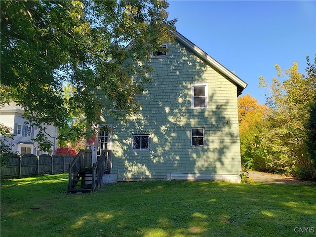 view of property exterior featuring a yard