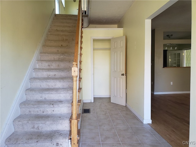 stairway with wood-type flooring